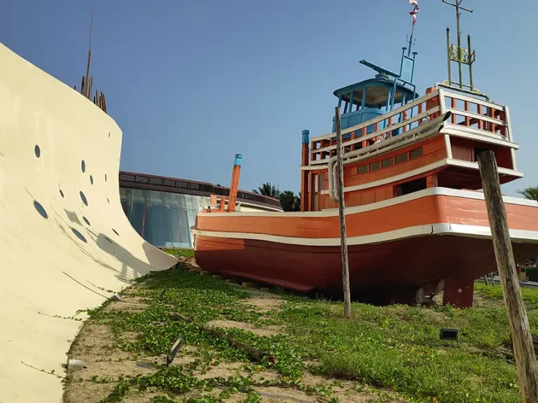 Orange Fishing Boat compared to the Tsunami Wave 768x576